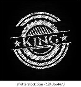 King chalk emblem written on a blackboard