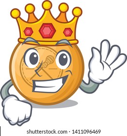 King lacrosse ball above wooden cartoon table