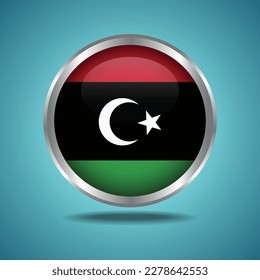 The Kingdom of Libya  flag. Round glossy. Silver frame. Isolated on color gradient background