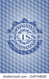 Kiss blue badge with geometric pattern background.
