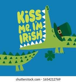 Kiss me I am Irish - funny St Patrik's Day lettering design with green crocodile on blue background. Good for posters, flyers, t-shirts, cards, invitations, stickers, banners, gifts.