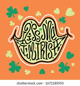 Kiss me, I'm Irish. Lettering in the form of lips, clover shamrock and green hearts on an orange background.