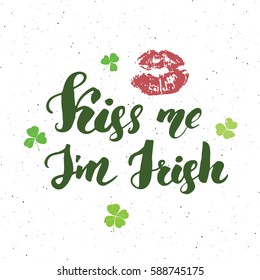 Kiss me, I'm irish. St Patrick's Day greeting card Hand lettering with lips and clovers, Irish holiday brushed calligraphyc sign vector illustration