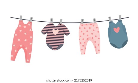 kit of newborn clothes on the cloth rope