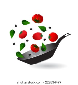 kitchen. Frying pan and tomatoes, leaves and olives
