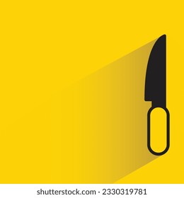 kitchen knife with shadow on yellow background