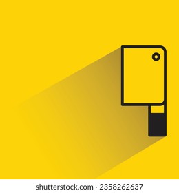kitchen knife with shadow on yellow background
