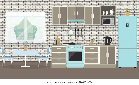 Kitchen on a brick wall background. There is a furniture, a stove, a blue refrigerator, a microwave, a kettle and other objects in the picture. There is also a table and chairs here. Vector image