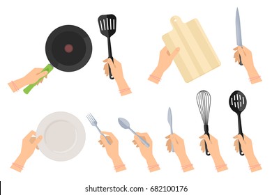 Kitchen steel utensils and kitchenware set. Female hands holding frying pan and plastic slotted spatula, ceramic dish, stainless fork, spoon and table-knife, wooden cutting board and knife.