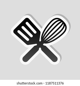 Kitchen tool icon. Whisk and spatula, criss and cross. Sticker style with white border and simple shadow on gray background