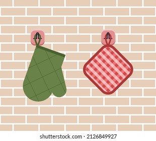 Kitchen utensils on the background of a brick wall. Potholder and backing on hooks in flat design. Vector stock illustration