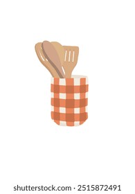 Kitchen Utensils : Wooden kitchen utensils placed in an orange checkered container.