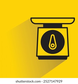 kitchen weight scale icon with shadow on yellow background