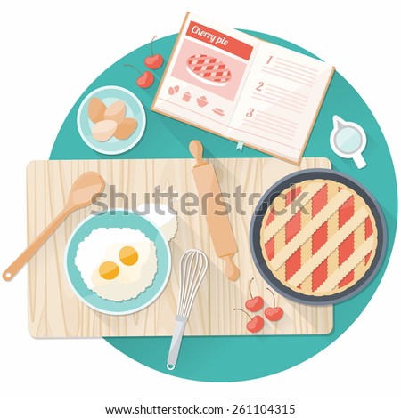 Kitchen worktop top view with utensils, open cookbook and cherry pie preparation