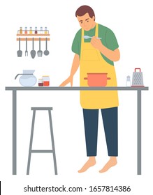 Kitchener tasting, glass dish on table. Portrait view of cooker character wearing apron cooking, hugging cutlery and seasoning on shelf, hobby vector