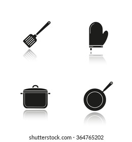 Kitchenware drop shadow black icons set. Logo concepts. Vector illustrations. Steel spatula, oven glove, stew pot and frying pan. Kitchen tools items. Cooking equipment. Cuisine instruments