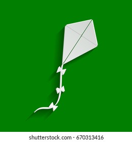 Kite sign. Vector. Paper whitish icon with soft shadow on green background.