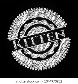 Kitten on chalkboard