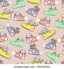Kittens in shoes. Seamless pattern on pink background.