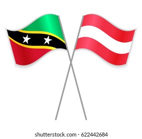 Kittitian and Austrian crossed flags. Saint Kitts and Nevis combined with Austria isolated on white. Language learning, international business or travel concept.