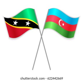Kittitian and Azerbaijani crossed flags. Saint Kitts and Nevis combined with Azerbaijan isolated on white. Language learning, international business or travel concept.