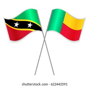 Kittitian and Beninese crossed flags. Saint Kitts and Nevis combined with Benin isolated on white. Language learning, international business or travel concept.