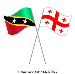 Kittitian and Georgian crossed flags. Saint Kitts and Nevis combined with Georgia isolated on white. Language learning, international business or travel concept.