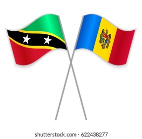 Kittitian and Moldovan crossed flags. Saint Kitts and Nevis combined with Moldova isolated on white. Language learning, international business or travel concept.