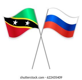 Kittitian and Russian crossed flags. Saint Kitts and Nevis combined with Russia isolated on white. Language learning, international business or travel concept.