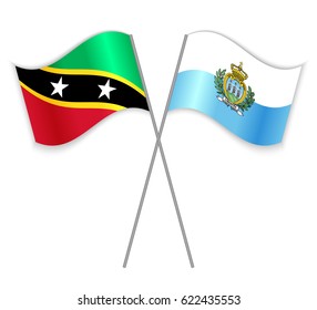 Kittitian and Sammarinese crossed flags. Saint Kitts and Nevis combined with San Marino isolated on white. Language learning, international business or travel concept.