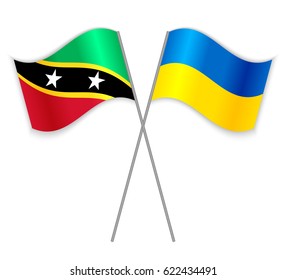Kittitian and Ukrainian crossed flags. Saint Kitts and Nevis combined with Ukraine isolated on white. Language learning, international business or travel concept.