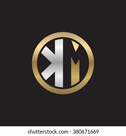 KM initial letters circle elegant logo golden silver black background