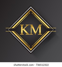 KM Letter logo in a square shape gold and silver colored geometric ornaments.