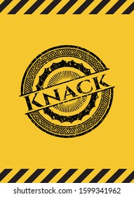 Knack black grunge emblem, yellow warning sign. Vector Illustration. Detailed.