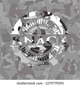 Knack on grey camouflaged texture
