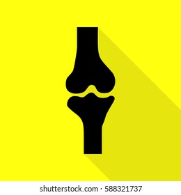 Knee joint sign. Black icon with flat style shadow path on yellow background.