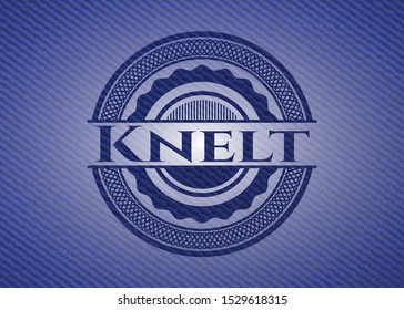 Knelt emblem with denim high quality background. Vector Illustration. Detailed.
