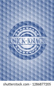 Knick-knack blue emblem with geometric pattern.
