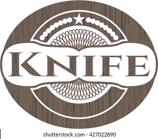 Knife badge with wood background