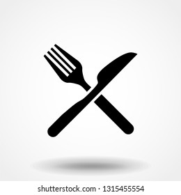 Knife and fork crossed icon vector