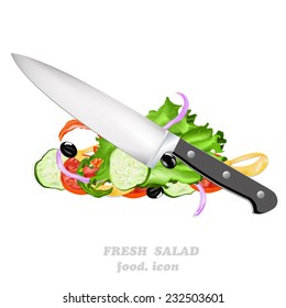 Knife and fresh vegetable salad