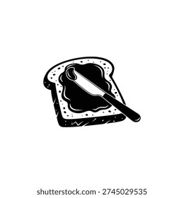 A knife spreading dark jam on a slice of bread with sesame seeds against a clean background