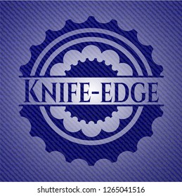 Knife-edge emblem with jean background