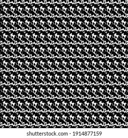 Knit fabric with stripes and more obvious rows of knots. Decoration in black and white.