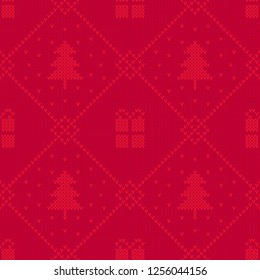 Knit pattern with fir trees and gift boxes. Cute, cosy and elegant winter pattern. Vintage knit design. Festive red christmas background.
