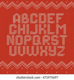 Knitted alphabet on red background. Christmas crochet font on knitted classic ornament pattern. All the letters are on different layers, it is convenient to produce words and sentences