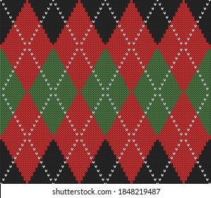 Knitted argyle Christmas and new year pattern. Wool knitinng. Scottish plaid in red, black and green rhombuses. Traditional  background of diamonds. Seamless fabric texture. Vector illustration