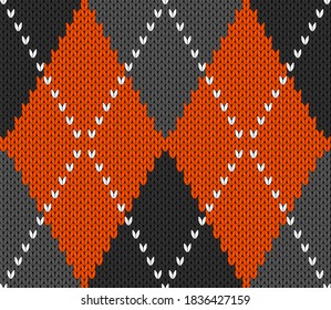 Knitted argyle Halloween pattern. Wool knitinng. Scottish plaid in orange, black and grey rhombuses. Traditional  Scottish background of diamonds . Seamless fabric texture. Vector illustration