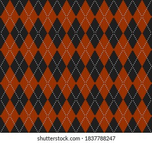 Knitted argyle Halloween pattern. Wool knitinng. Scottish plaid in orange and black rhombuses. Traditional  Scottish background of diamonds . Seamless fabric texture. Vector illustration