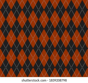 Knitted argyle Halloween pattern. Wool knitinng. Scottish plaid in orange and black rhombuses. Traditional  Scottish background of diamonds . Seamless fabric texture. Vector illustration